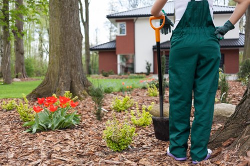 Team following a garden maintenance safety procedure in an outdoor setting